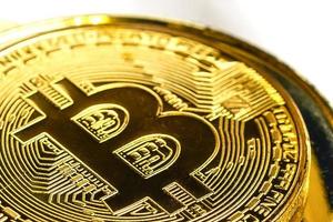 Golden bitcoin isolated on white background photo