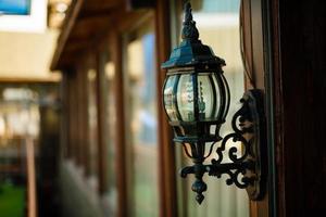 Street lamp on the wall of hotel photo