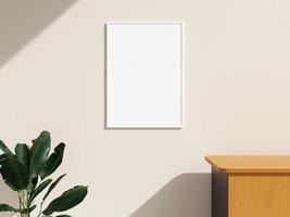 Frame mockup hanging on the wall in minimalist interior room with plant photo