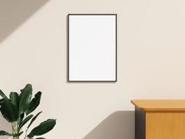 maqueta de marco colgada en la pared en una habitación interior minimalista con planta foto