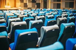 Empty blue cinema seats, chairs. Perspective view photo