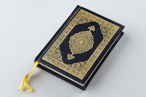 The holy book of Muslims, the Holy Quran, is decorated with gold photo