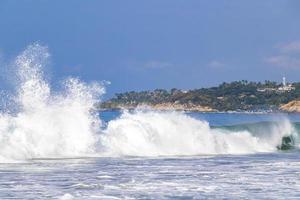 Extremely huge big surfer waves at beach Puerto Escondido Mexico. photo