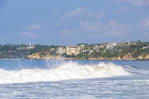 Extremely huge big surfer waves at beach Puerto Escondido Mexico. photo