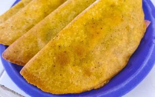 Mexican empanada on blue plate from Playa del Carmen Mexico. photo