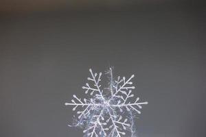 Winter snowflake with glowing threads photo
