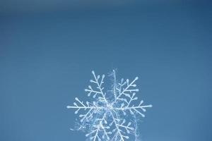 Winter snowflake with glowing threads photo