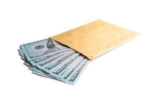 Pile of new design US dollar bills in brown envelope isolated on white background photo