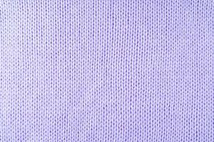 Bright purple knitwear wool fabric texture background. Abstract textile backdrop photo