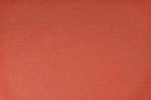 Texture of red fabric diagonal weave pattern. Decorative textile background photo