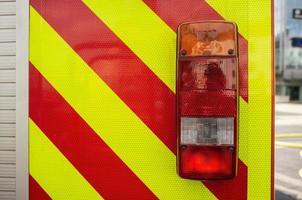 Close-up fire truck, with red lights for safe driving, outdoors. photo