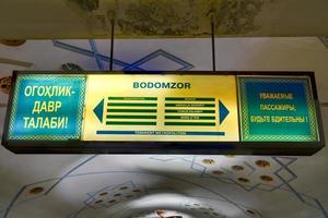 Tashkent Uzbekistan  July 8 2019   Bodomzor Metro Station in Tashkent Uzbekistan Sign saying to be attentive photo