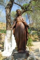 Statue of the Virgin Mary in yard of The House of the Virgin Mary The House of the Virgin Mary Meryemana believed to be the last residence of Mary mother of Jesus Ephesus Turkey photo