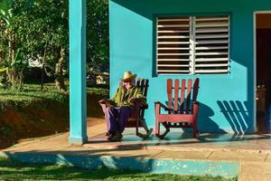 Vinales Cuba  January 11 2017   Local cuban man sitting in front of his house in Vinales Cuba photo