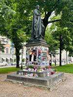 Munich Germany  July 8 2021   Souvenirs of Michael Jackson placed around a statue at Promenadenplatz photo