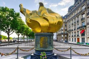 The Flame of Liberty in Paris is a fullsized goldleafcovered replica of the new flame at the upper end of the torch of the Statue of Liberty at the entrance to the harbor of New York since 1986 photo