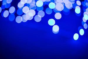Blur lights background. Blur blue lights on black background. bokeh lanterns on a blue background photo