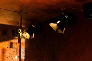 lamp on an old box in a vintage interior with brick walls photo