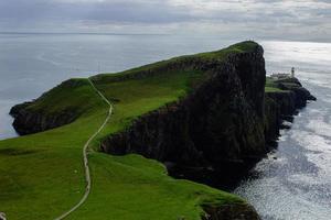 ocean coast at Neist point lighthouse, Scotland photo