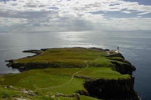 ocean coast at Neist point lighthouse, Scotland photo