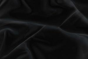 Smooth elegant black silk fabric or satin luxury cloth texture for abstract background photo