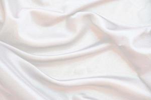 Smooth elegant white silk fabric or satin luxury cloth texture for abstract background photo
