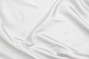 Smooth elegant white silk fabric or satin luxury cloth texture for abstract background photo