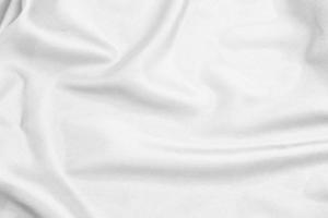 tela de seda blanca suave y elegante o textura de tela satinada de lujo para un fondo abstracto foto