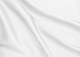 Smooth elegant white silk fabric or satin luxury cloth texture for abstract background photo