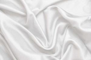 Smooth elegant white silk fabric or satin luxury cloth texture for abstract background photo