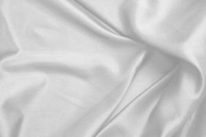 Smooth elegant white silk fabric or satin luxury cloth texture for abstract background photo