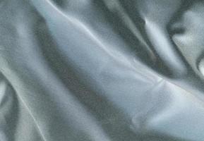 Smooth elegant black silk fabric or satin luxury cloth texture for abstract background photo