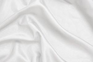 Smooth elegant white silk fabric or satin luxury cloth texture for abstract background photo