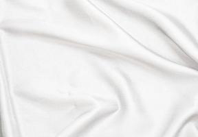 Smooth elegant white silk fabric or satin luxury cloth texture for abstract background photo