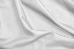 Smooth elegant white silk fabric or satin luxury cloth texture for abstract background photo
