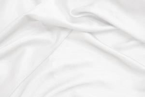 Smooth elegant white silk fabric or satin luxury cloth texture for abstract background photo