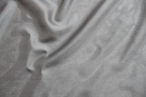 Smooth elegant black silk fabric or satin luxury cloth texture for abstract background photo