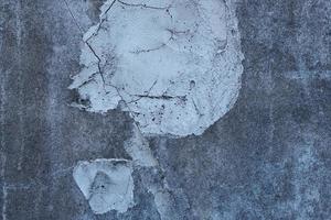 gray cement wall background with cracks photo