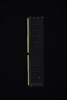 Black RAM bar on a black background. Computer RAM. photo