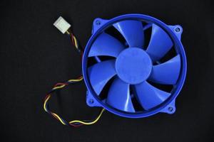 Blue electric fan for cooling the computer processor. Computer fan. photo
