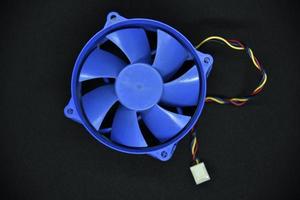 Blue electric fan for cooling the computer processor. Computer fan. photo