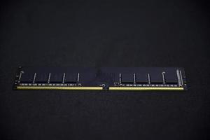 Black RAM bar on a black background. Computer RAM. photo
