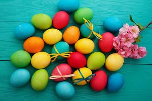 colorful easter eggs top view on blue chalkboard copy space photo