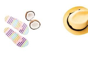 Summer accessories. Shoes, hat, coconut. Summertime background isolated on white. Flip flops top view. Striped slippers. photo