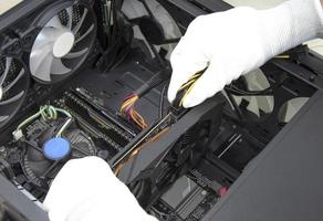 top view mechanic installing graphics card photo