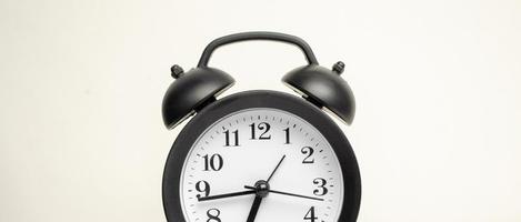 Alarm clock black style vintage place on a white background. photo