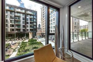 Modern apartment in new buliding in Montreal, Griffintown, Canada, fully staged and furnished photo