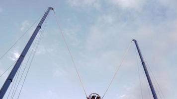 Extreme flying dangerous attraction. Jumping on rubber ropes. Extreme types of recreation and entertainment. A large catapult that shoots brave men. video