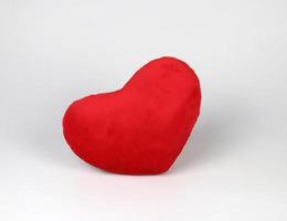 red heart pillow on white background, isolated. Valentine's day concept photo