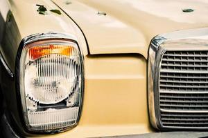 Vintage car headlight, vintage auto detail, selective focus, idea for interior or article photo